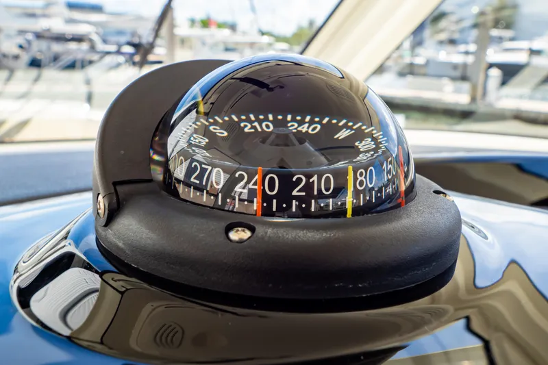 Slide: The Image of Compass on 2019 Boston Whaler 350 Realm boat dashboard, close-up view. - 18