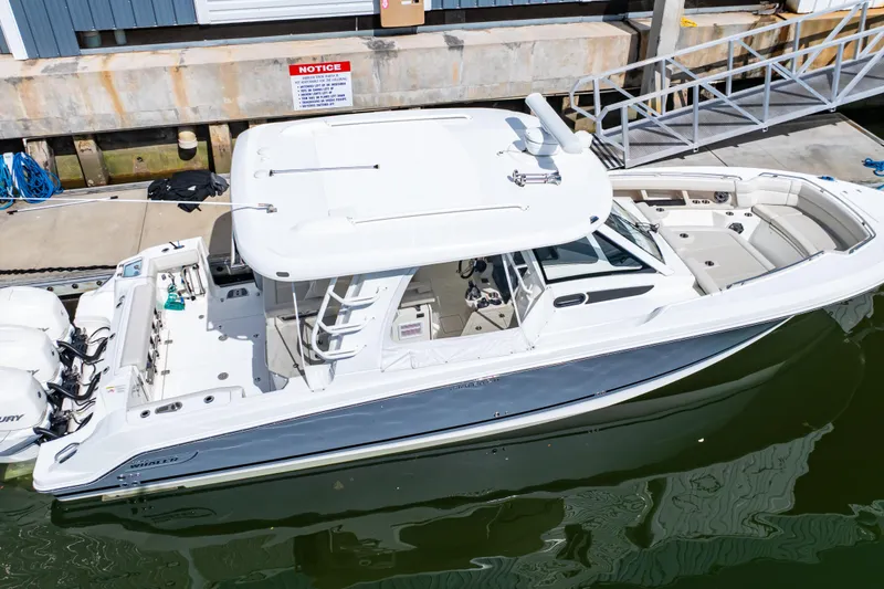 Slide: The Image of 2019 Boston Whaler 350 Realm boat docked at marina, top view. - 19