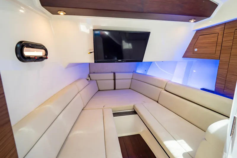 Slide: The Image of Luxurious interior of 2019 Boston Whaler 350 Realm with plush seating and TV. - 30