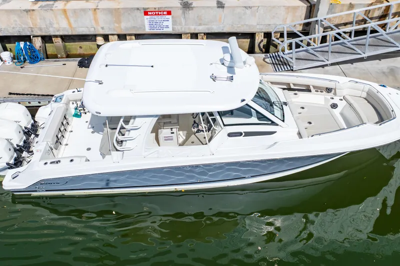 Slide: The Image of 2019 Boston Whaler 350 Realm boat docked at marina, aerial view. - 43