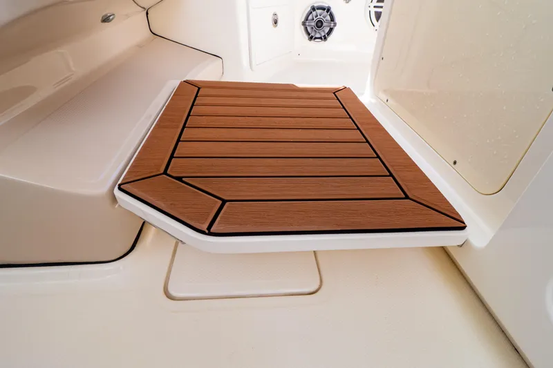 Slide: The Image of Teak deck detail on 2019 Boston Whaler 350 Realm boat interior. - 87