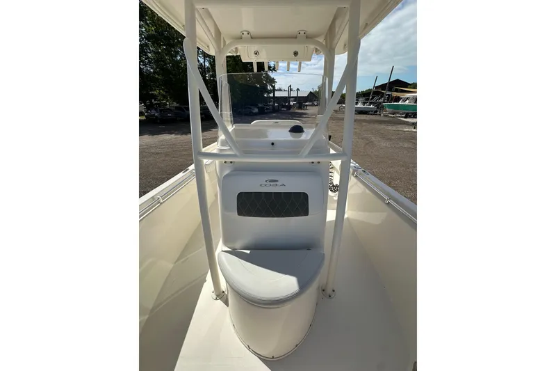 Slide: The Image of 2022 Cobia 220 Center Console boat interior with seating and console view. - 20