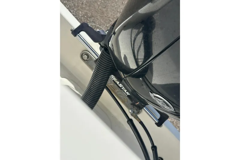 Slide: The Image of Close-up of 2022 Cobia 220 Center Console boat engine components. - 29