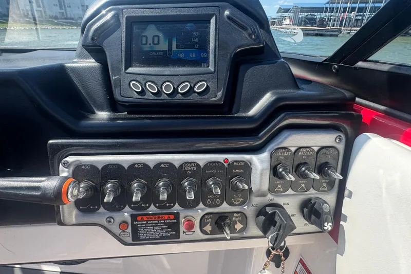 Slide: The Image of Control panel of a 2017 Moomba Helix boat with switches and digital display. - 16