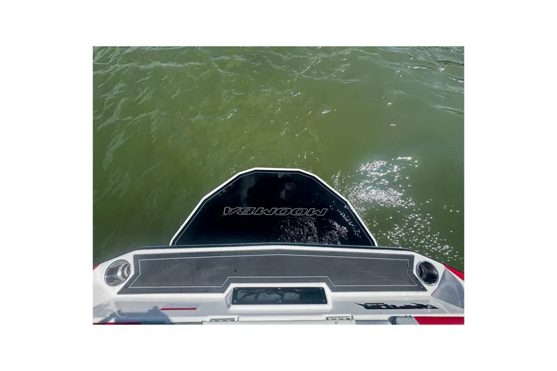 Slide: The Image of 2017 Moomba Helix boat stern on water, showcasing brand logo and deck. - 25