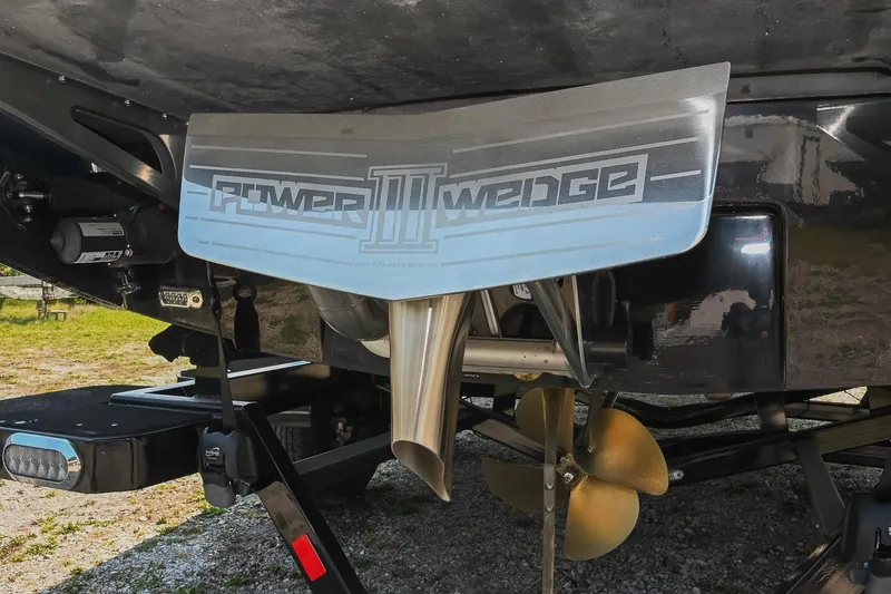 Slide: The Image of Axis T220 2023 boat with Power Wedge III and propeller detail. - 11