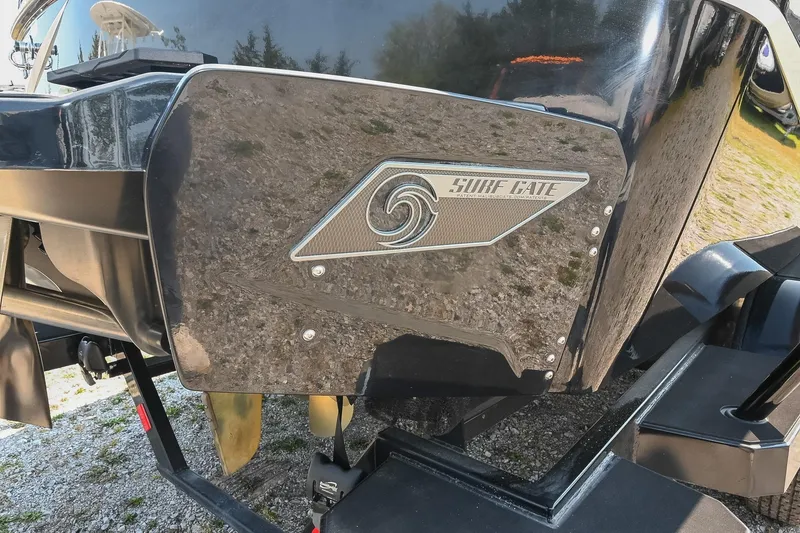 Slide: The Image of 2023 Axis T220 boat with Surf Gate technology, close-up view. - 12