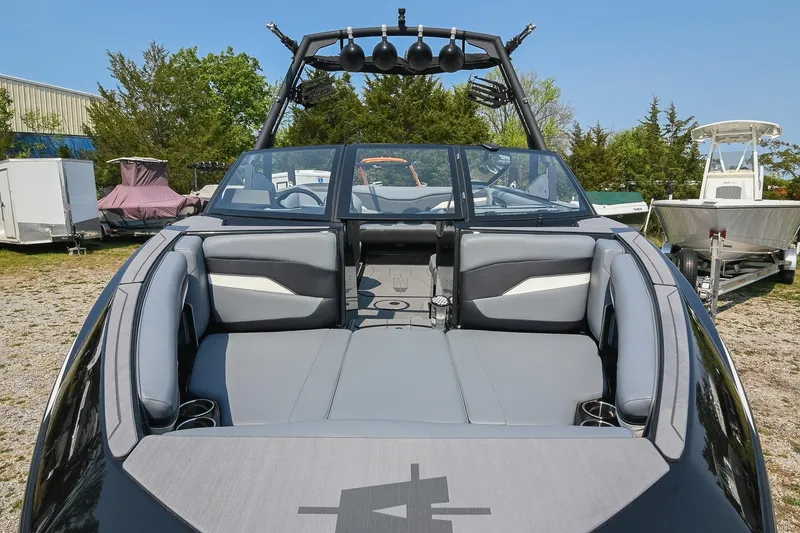 Slide: The Image of 2023 Axis T220 boat with sleek gray seating and modern design. - 13
