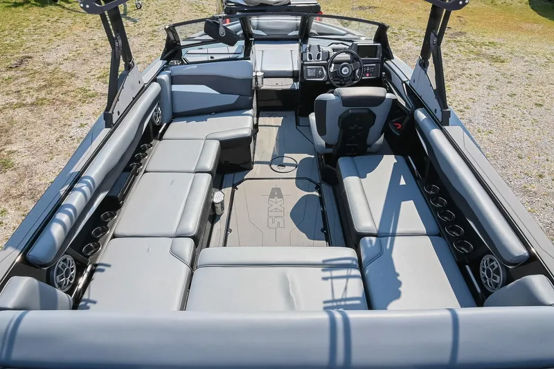 Slide: The Image of 2023 Axis T220 boat interior with spacious seating and modern dashboard design. - 14