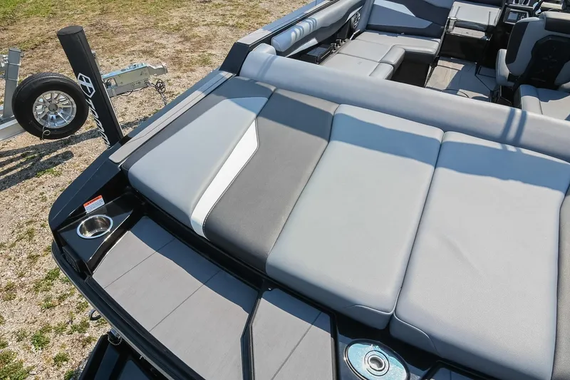 Slide: The Image of 2023 Axis T220 boat interior with gray seating and cup holders. - 16