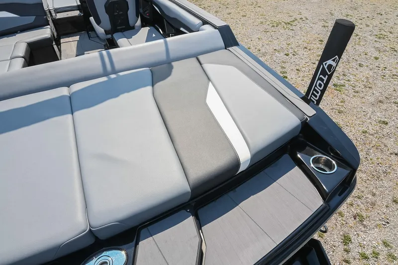 Slide: The Image of 2023 Axis T220 boat interior with gray seating and cup holders. - 18
