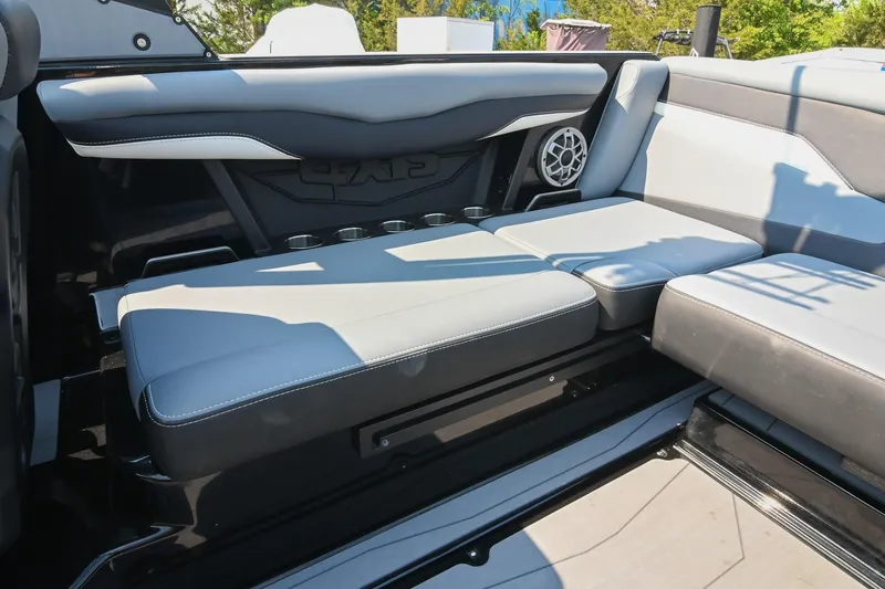 Slide: The Image of 2023 Axis T220 boat interior with gray seating and speaker system. - 21