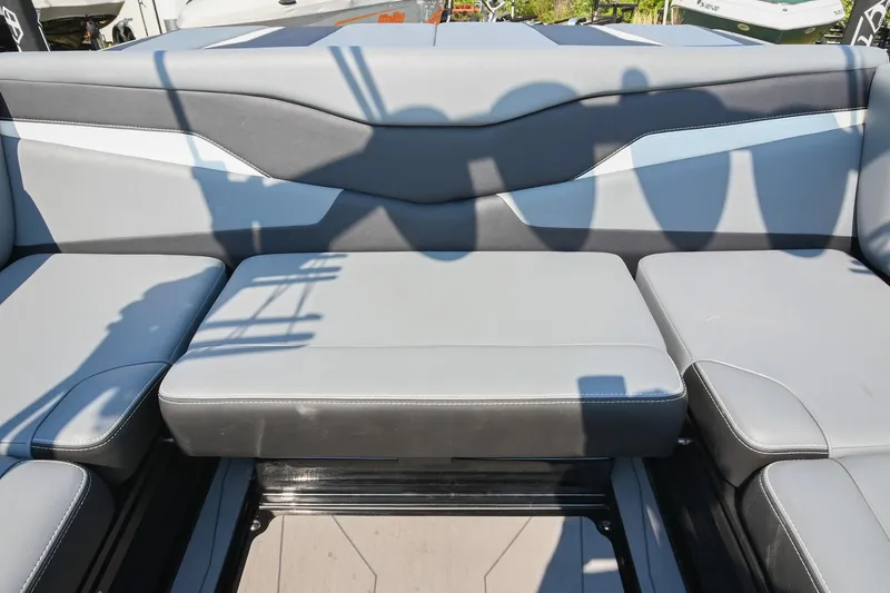 Slide: The Image of 2023 Axis T220 boat interior with sleek gray seating and modern design. - 24