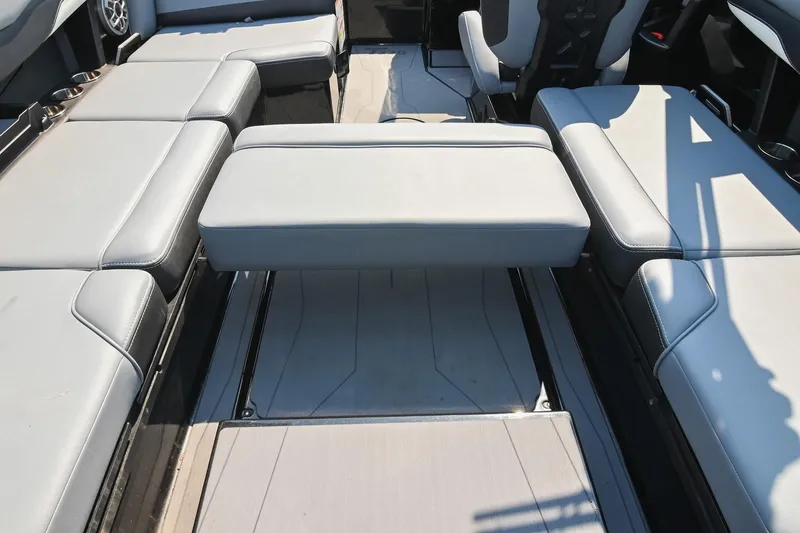 Slide: The Image of 2023 Axis T220 boat interior with gray cushioned seating and sleek design. - 30