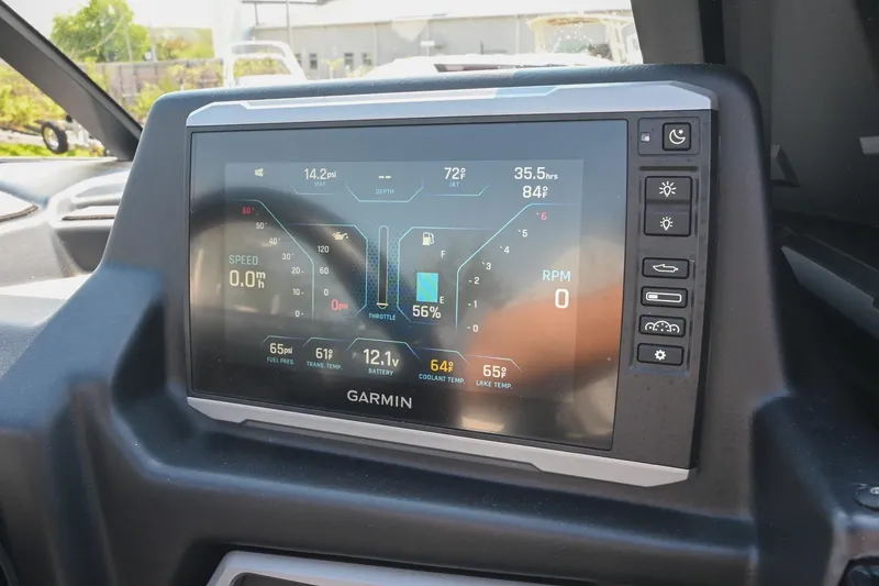 Slide: The Image of Garmin display in 2023 Axis T220 boat showing speed, RPM, and temperature metrics. - 34