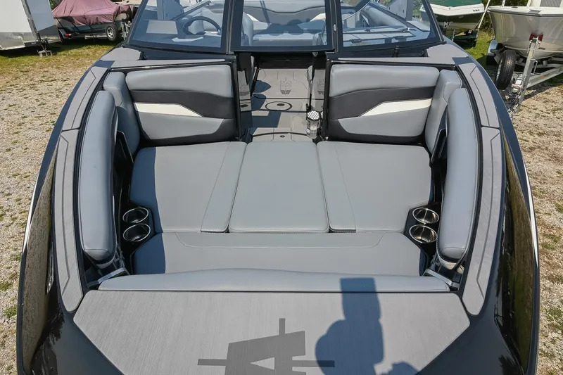 Slide: The Image of 2023 Axis T220 boat interior with gray seating and cup holders. - 37