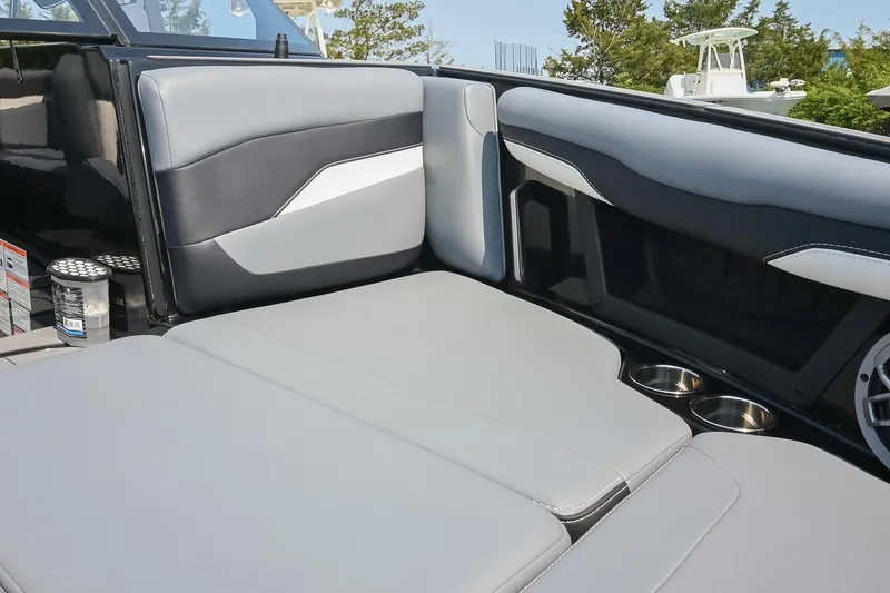 Slide: The Image of 2023 Axis T220 boat interior with gray seating and cup holders. - 39