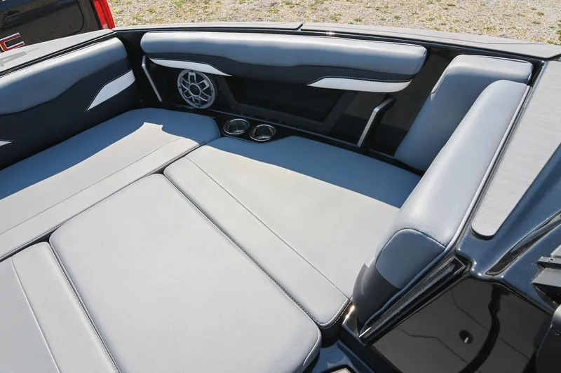 Slide: The Image of 2023 Axis T220 boat interior with gray seating, speaker, and cup holders. - 41