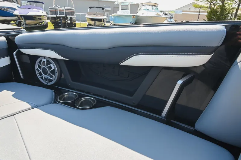 Slide: The Image of Interior of 2023 Axis T220 boat featuring speaker and cup holders. - 43