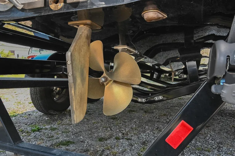 Slide: The Image of 2023 Axis T220 boat propeller and rudder on a trailer, close-up view. - 45