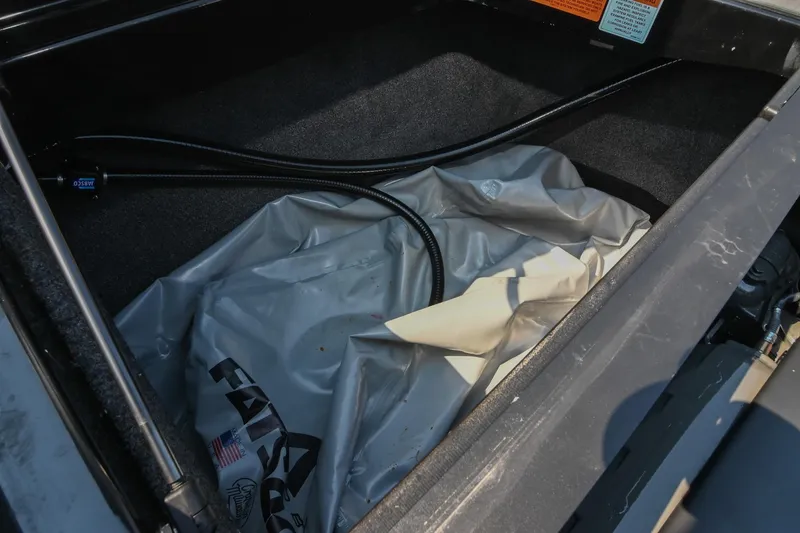 Slide: The Image of 2023 Axis T220 storage compartment with FatSac ballast bag and hoses. - 47