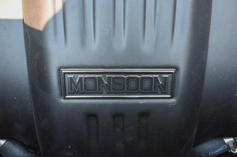 Slide: The Image of Close-up of 2023 Axis T220 engine cover with "Monsoon" branding. - 49