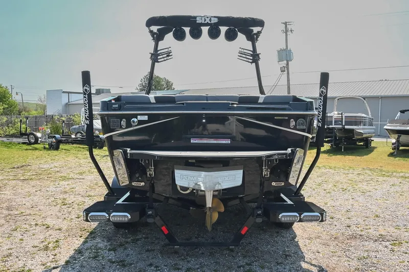 Slide: The Image of 2023 Axis T220 boat rear view with wakeboard tower and swim platform. - 5