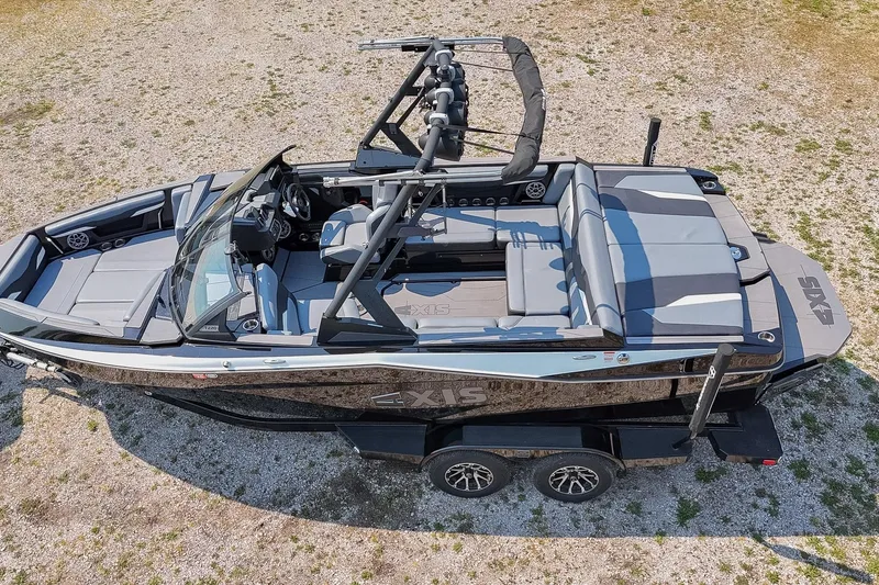 Slide: The Image of 2023 Axis T220 boat on trailer, aerial view, sleek design, spacious seating. - 51