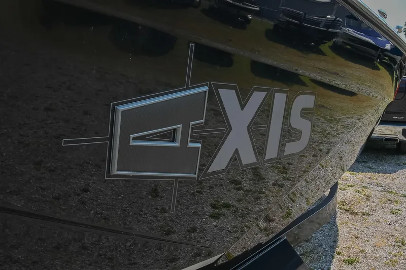 Slide: The Image of 2023 Axis T220 boat logo on sleek black hull, reflecting surroundings. - 6