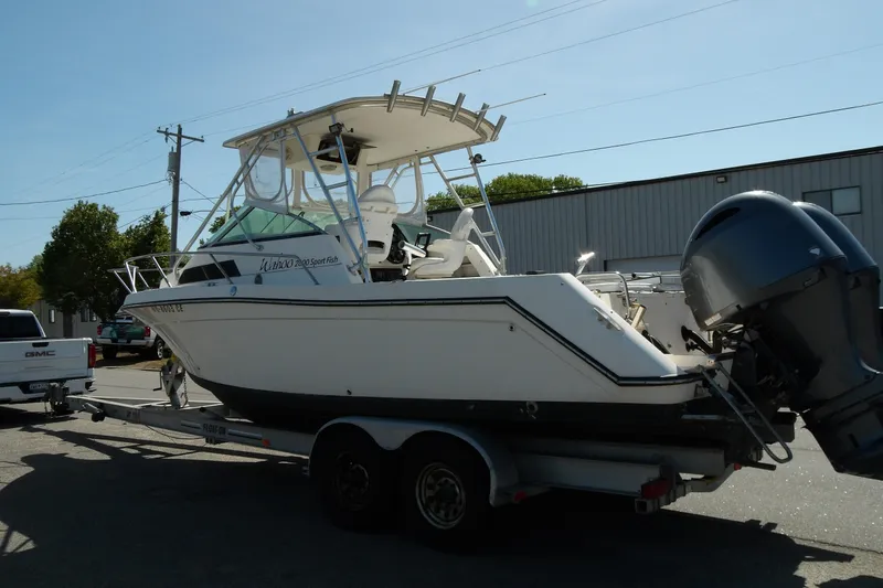Slide: The Image of 1993 Wahoo 2600 Sport Fish boat on trailer, parked outdoors. - 4