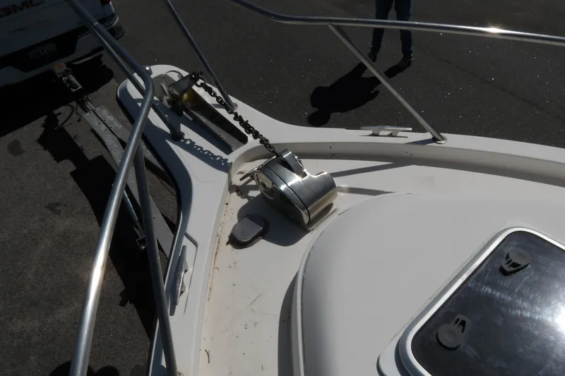 Slide: The Image of Bow of a 1993 Wahoo 2600 boat with anchor chain and railing. - 28