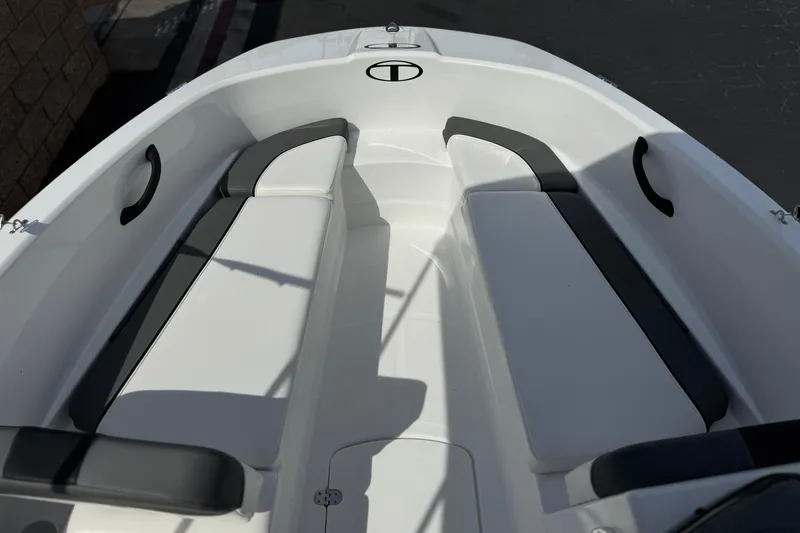 Slide: The Image of 2025 Tahoe T16 boat interior with sleek white seating and modern design. - 11