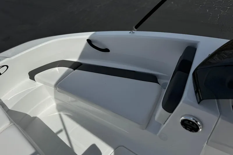 Slide: The Image of 2025 Tahoe T16 boat interior with sleek white seating and modern design. - 13