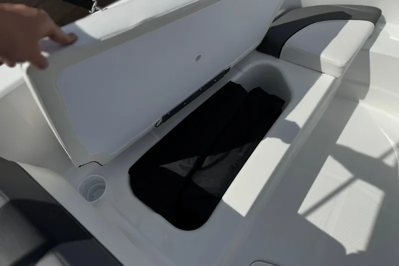 Slide: The Image of Open storage compartment in 2025 Tahoe T16 boat, showcasing spacious interior design. - 14