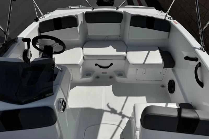 Slide: The Image of 2025 Tahoe T16 boat interior with seating, steering wheel, and modern design features. - 18