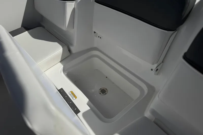 Slide: The Image of 2025 Tahoe T16 boat interior with seating and storage compartment. - 21