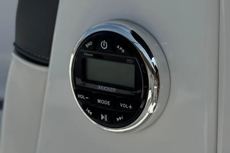 Slide: The Image of Close-up of a Kicker audio system in a 2025 Tahoe T16 boat. - 30