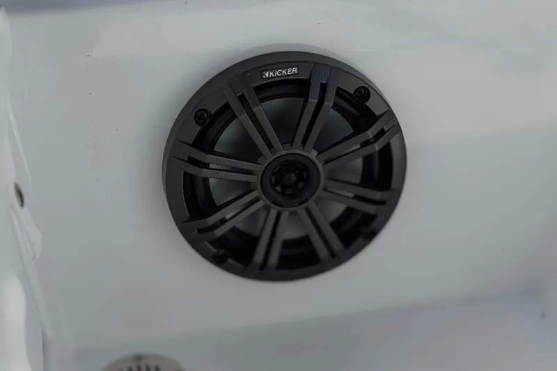 Slide: The Image of Close-up of a Kicker speaker in a 2025 Tahoe T16 boat interior. - 31