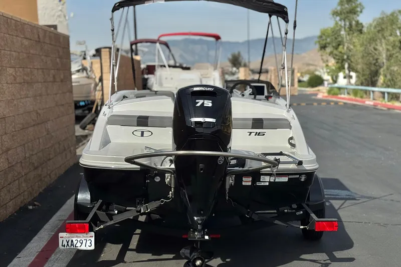 Slide: The Image of 2025 Tahoe T16 boat with Mercury 75 engine, parked on a sunny day. - 4