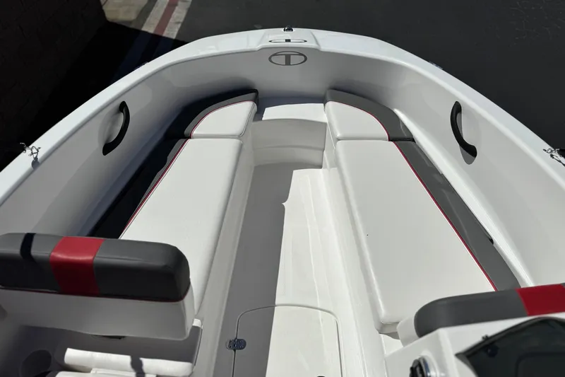 Slide: The Image of 2024 Tahoe T16 boat interior with white seating and red accents. - 11