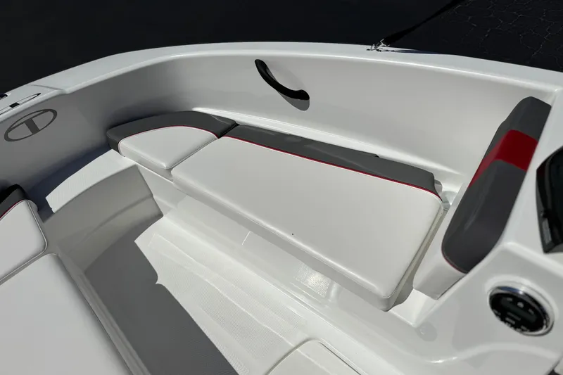 Slide: The Image of 2024 Tahoe T16 boat interior with white and gray seating, red accents. - 13