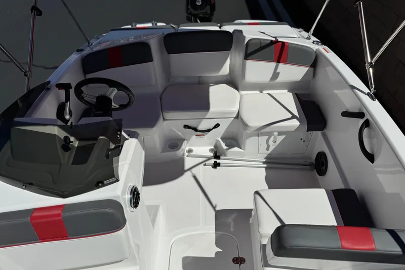 Slide: The Image of 2024 Tahoe T16 boat interior with modern seating and steering wheel. - 15