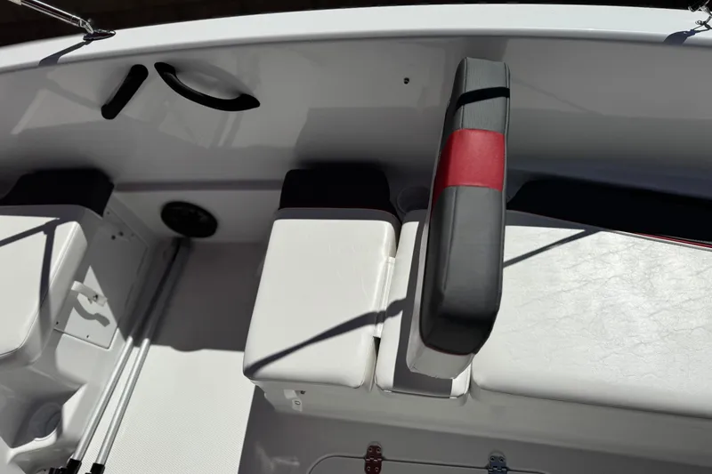 Slide: The Image of Interior of 2024 Tahoe T16 boat featuring white seating and red accents. - 16