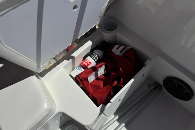 Slide: The Image of Storage compartment in 2024 Tahoe T16 boat with gear and accessories. - 19