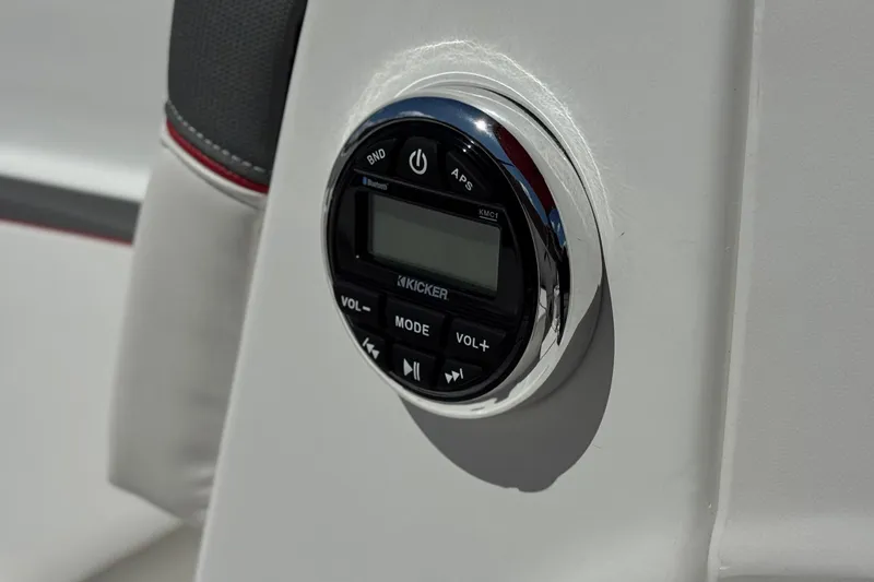 Slide: The Image of 2024 Tahoe T16 boat audio control panel with Kicker stereo system. - 28