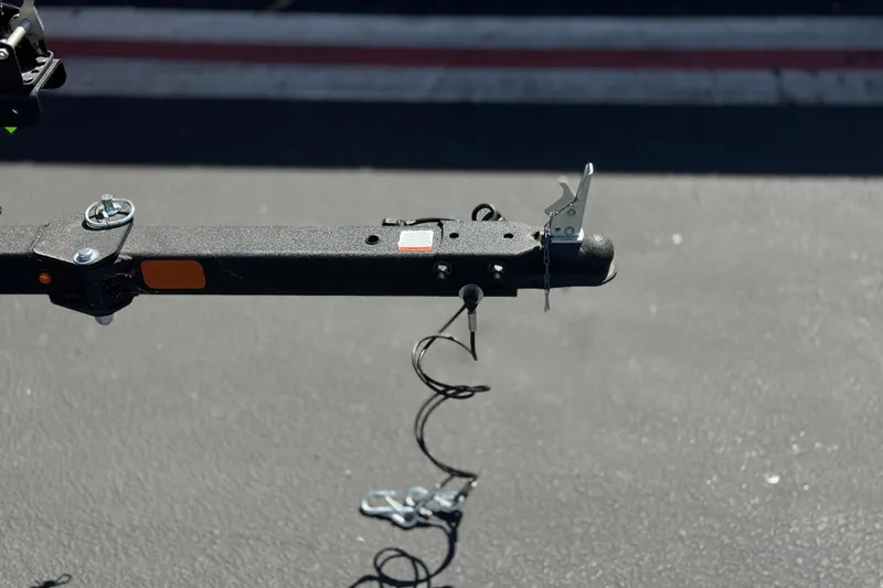 Slide: The Image of Trailer hitch of a 2024 Tahoe T16 on asphalt background. - 30