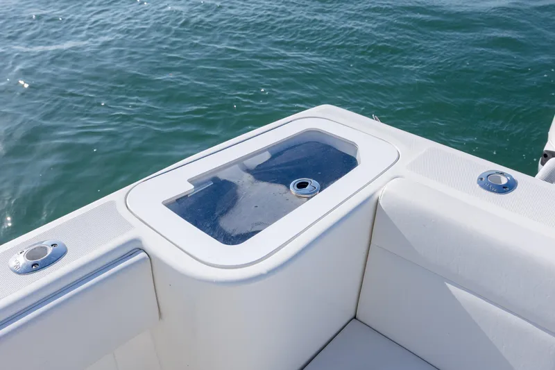 Slide: The Image of 2019 SeaVee 370Z boat with a sleek deck design on calm water. - 12