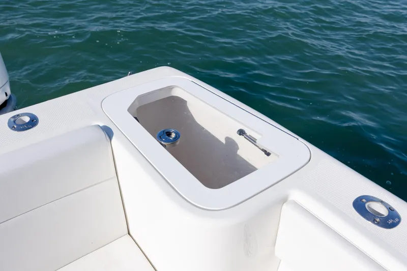 Slide: The Image of 2019 SeaVee 370Z boat with open storage compartment, on calm water. - 13