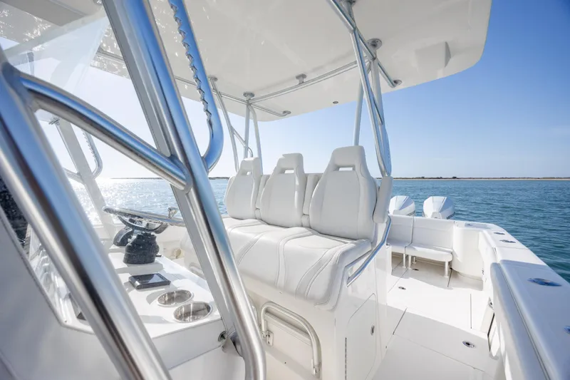 Slide: The Image of 2019 SeaVee 370Z boat interior with white seating and ocean view. - 21