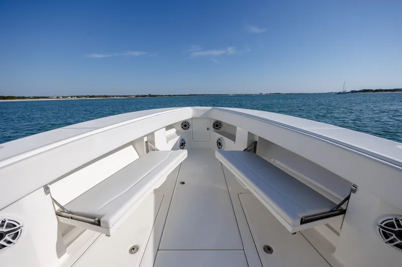 Slide: The Image of 2019 SeaVee 370Z boat interior with seating, on calm blue water. - 23